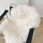 A chair with a soft Mellow Pet Store Natural Sheepskin Rug for Pet on it.