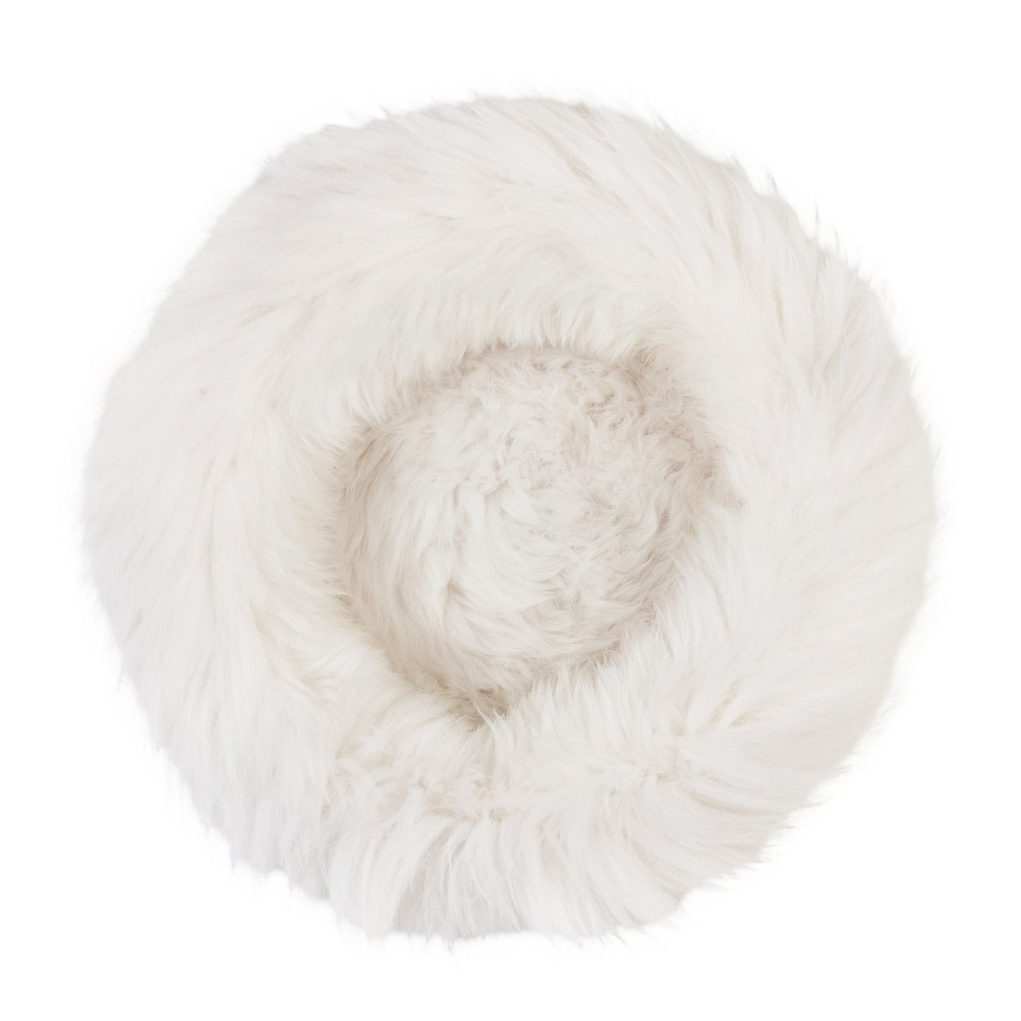 A Round Natural Sheepskin Pet Bed made from natural sheepskin on a white background by Mellow Pet Store.