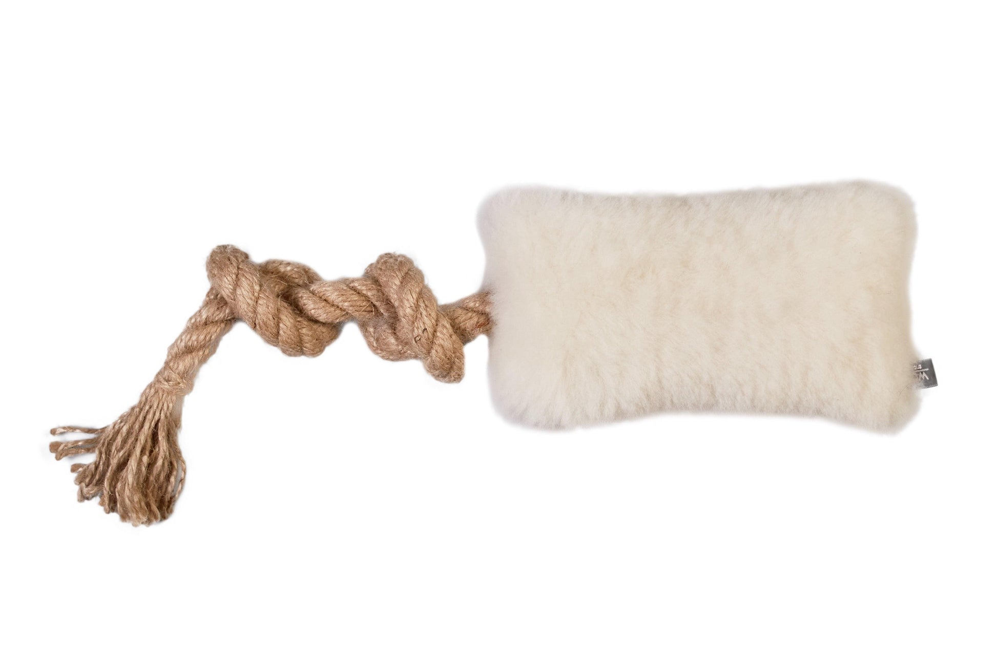 An organic Natural Sheepskin Dog Tug Toy with a rope attached to it, great for eco-friendly pet products from Mellow Pet Store.