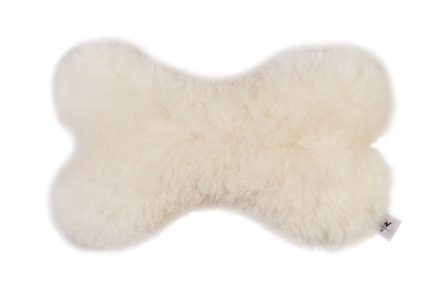 A soft Natural Sheepskin Dog Toy Bone from Mellow Pet Store on a bright white background.