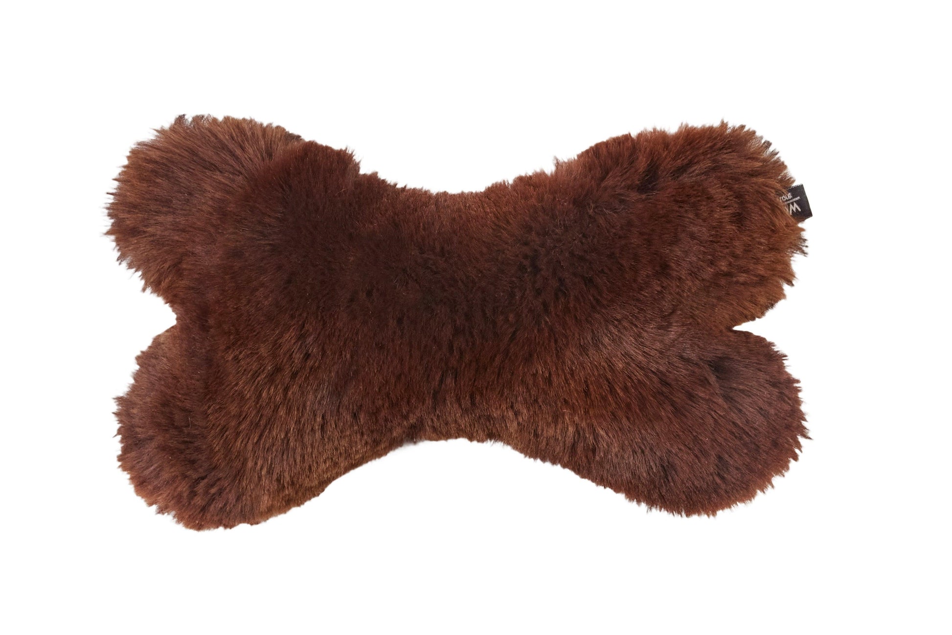 A brown furry Natural Sheepskin Dog Toy Bone made with natural materials by Mellow Pet Store.